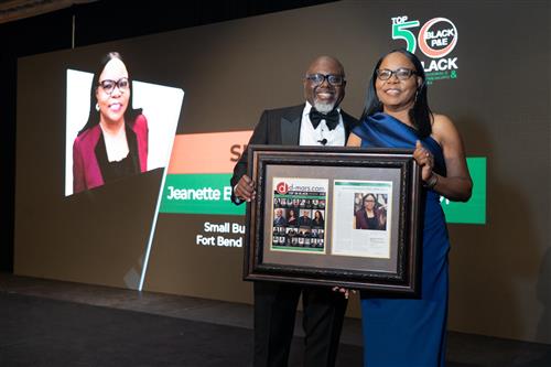 Jeanette Bolewars receiving Top 50 Award